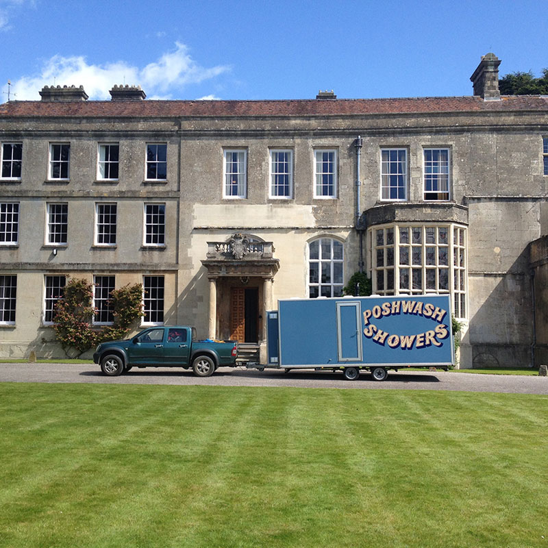 Posh wash unit outside a stately home A 5 Bay Posh Wash Shower Unit